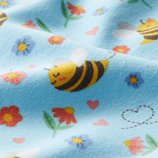 Katoenjersey Snoopy op de bloemenweide – lichtblauw, 