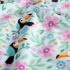 Katoenjersey Toekans in de bloemenjungle – babyblauw/oranje, 
